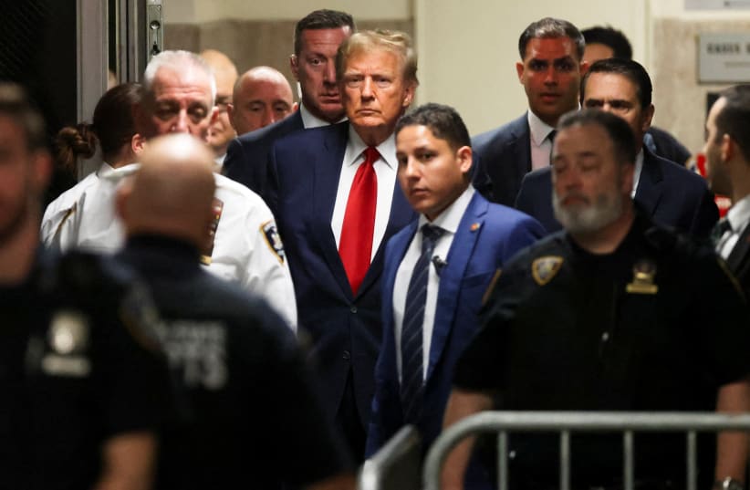  Former U.S. President Donald Trump arrives on the day of a court hearing on charges of falsifying business records to cover up a hush money payment to a porn star before the 2016 election, in New York State Supreme Court in the Manhattan borough of New York City, U.S., February 15, 2024. (photo credit: REUTERS/ANDREW KELLY)