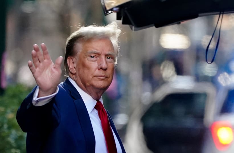  Former U.S. President Donald Trump gestures as he walks outside Trump Tower to attend a court hearing on charges of falsifying business records to cover up a hush money payment to a porn star before the 2016 election, in New York City, U.S., February 15, 2024.  (photo credit: REUTERS/BING GUAN)