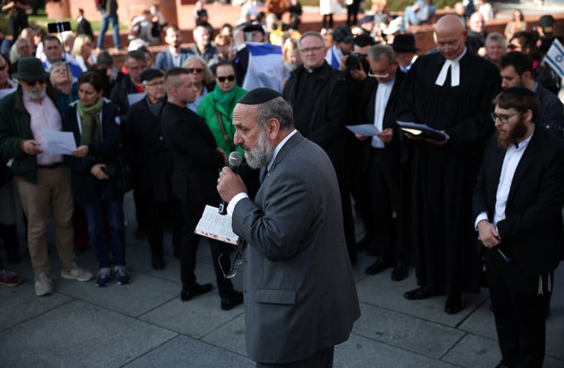  The Chief Rabbi of Poland, Michael Schudrich, leads a multi-confessional prayer for peace after terrorists from Hamas entered Israeli territory on Saturday, at Old Town in Warsaw, Poland, October 13, 2023. (photo credit: KACPER PEMPEL/REUTERS)
