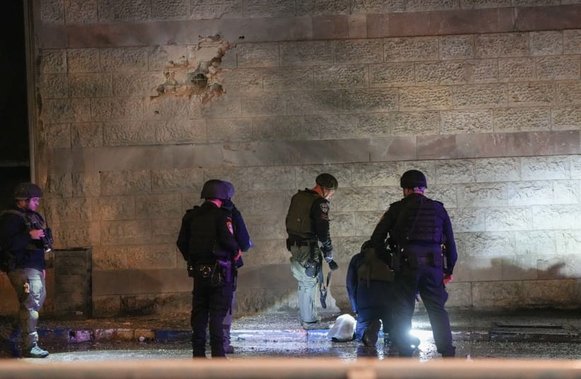  Israeli security forces near the damage after a rocket fired from Lebanon hit the northern town of Kiryat Shmona, February 15, 2024.  (photo credit: AYAL MARGOLIN/FLASH90)