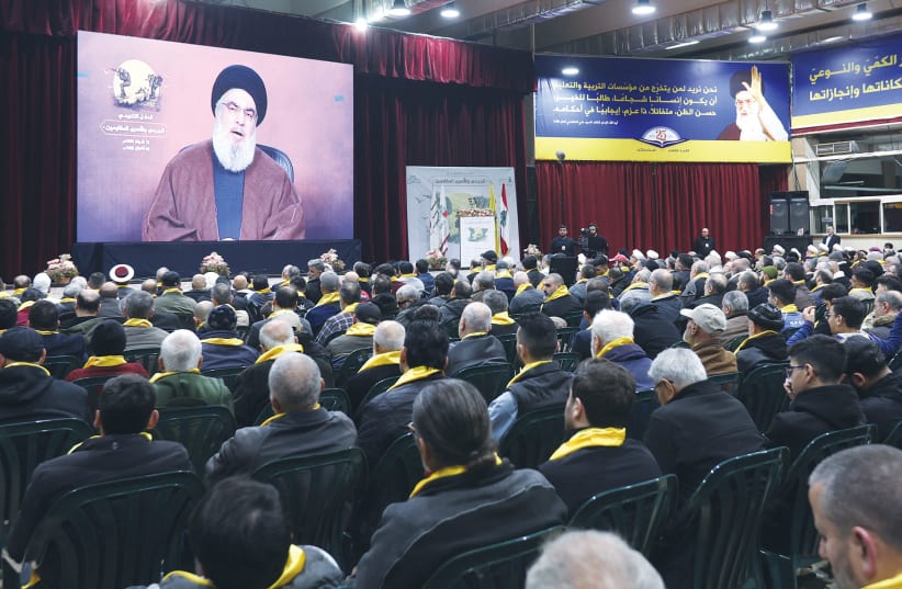  HEZBOLLAH LEADER Sheikh Hassan Nasrallah delivers a video address during a rally in Beirut last week. (photo credit: AZIZ TAHER/REUTERS)