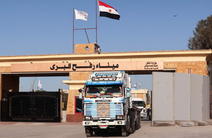  A truck crosses from Gaza to Egypt, at the Rafah border crossing between Egypt and the Gaza Strip, amid the ongoing conflict between Israel and Palestinian Islamist group Hamas, in Rafah, Egypt (photo credit: MOHAMED ABD EL GHANY/REUTERS)