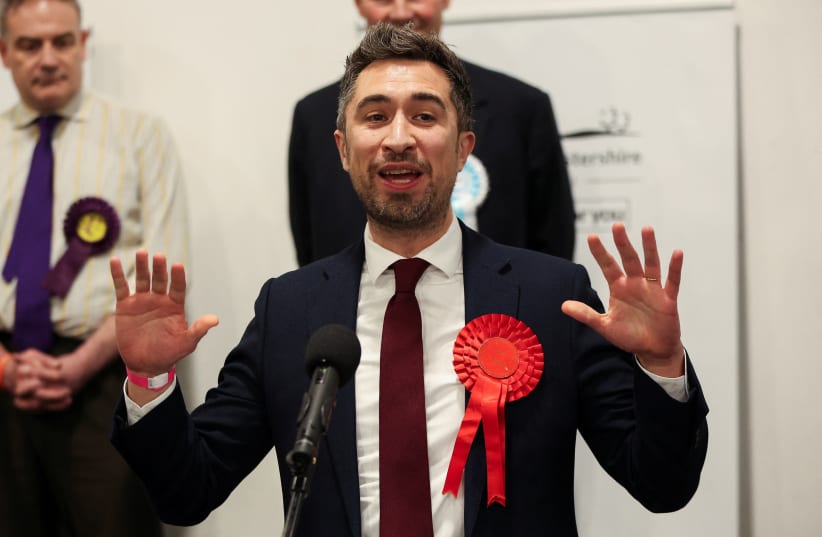 Labour Party candidate Damien Egan reacts after winning the Kingswood Parliamentary by-election at Thornbury Leisure centre in Thornbury, Britain, February 16, 2024. (photo credit: PHIL NOBLE/REUTERS)