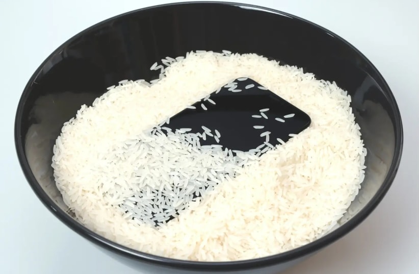 iPhone in a bowl of rice (photo credit: INGIMAGE)