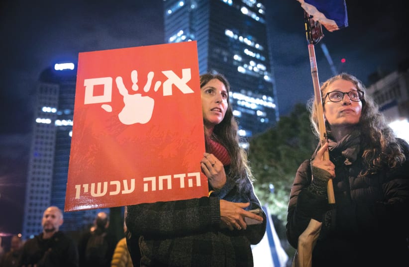  A PROTEST against the Netanyahu government takes place in Tel Aviv, on Saturday night. The placard reads: ‘[He’s] Guilty, oust [him] now.’ (photo credit: MIRIAM ALSTER/FLASH90)
