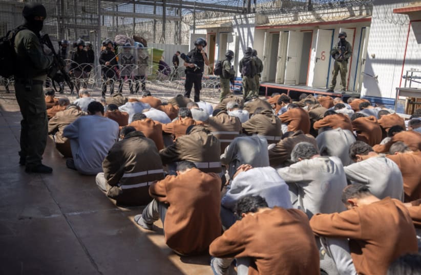  Hamas terrorists who were caught during the October 7 massacre and during the IDF operation in the Gaza Strip, seen at a courtyard in a prison in southern Israel, February 14, 2024 (photo credit: Chaim Goldberg/Flash90)