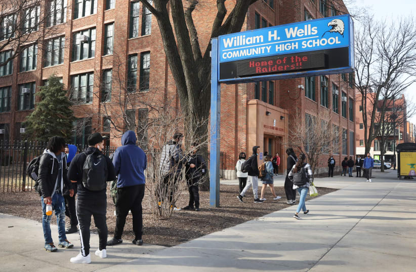 Students leave William Wells High School, part of Chicago Public Schools, March 14, 2022, in Chicago Illinois. CPS is the subject of a new federal Title VI discrimination investigation with the Department of Education. (photo credit: SCOTT OLSON/GETTY IMAGES/JTA)