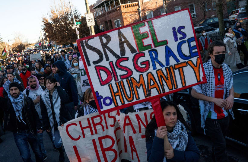  Pro-Palestinian demonstrators march after taking part in a rally demanding a ceasefire and the end of Israel attacks on Gaza at the borough of Queens in New York, U.S., February 19, 2024. (photo credit: REUTERS/EDUARDO MUNOZ)