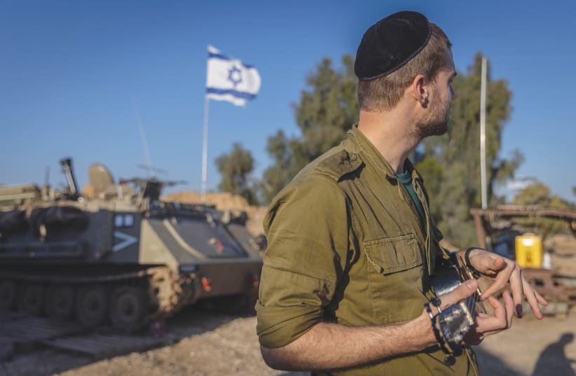  IDF FATIGUES: Color may be drab, but it resonates with our collective hopes.  (photo credit: Chaim Goldberg/Flash90)