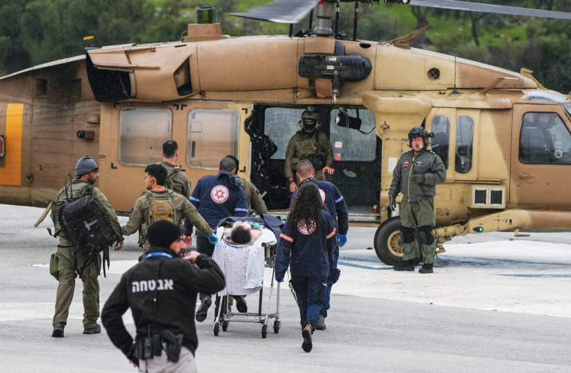  A MILITARY helicopter evacuates the wounded from Ziv Medical Center, injured by a Hezbollah missile fired earlier that day, to a Safed IDF base, Feb. 14.  (photo credit: AYAL MARGOLIN/FLASH90)