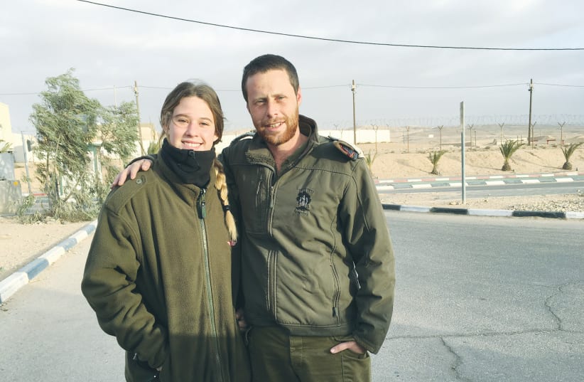  IN HAPPIER times, the writer poses with her cousin, IDF Maj. Moti Shamir, who was killed on October 7, saving others.  (photo credit: Daniella Shamir)