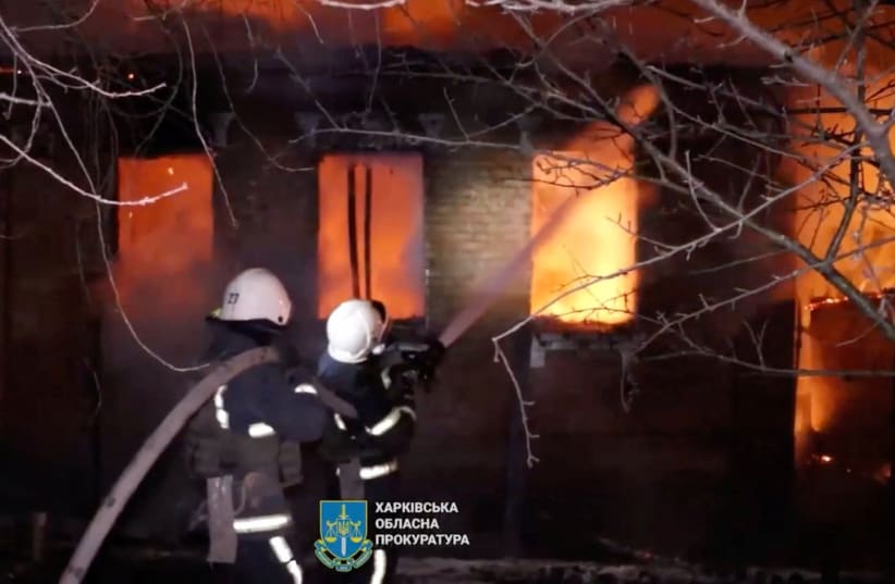 Firefighters work at a site of a fire after Russian drones strike, amid Russia's attack on Ukraine, in Kharkiv, Ukraine, in this screengrab obtained from a handout video released February 10, 2024. (photo credit: Head of Kharkiv Regional Military Administration Oleg Syniehubov via Telegram/Handout via REUTERS)