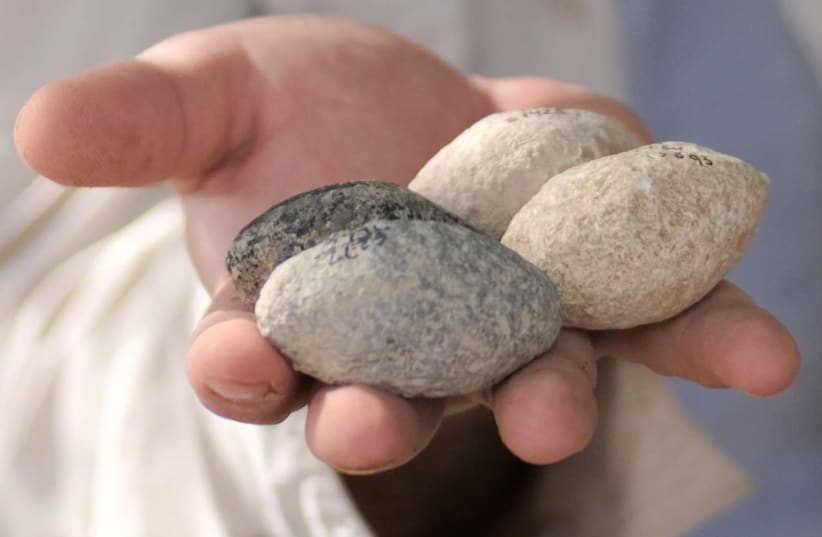  7,000-year-old sling stones discovered in Israel. (photo credit: EMIL ALADJEM/ISRAEL ANTIQUITIES AUTHORITY)