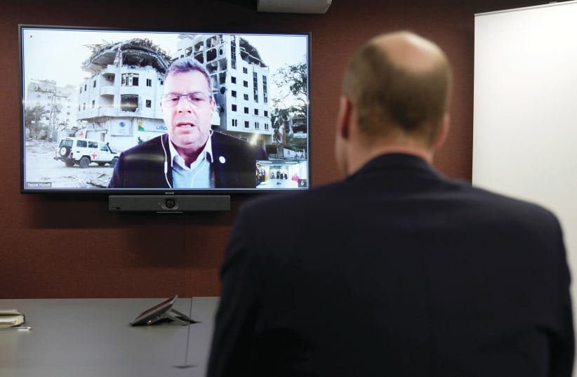  PRINCE WILLIAM listens to Pascal Hundt, senior crisis manager of the International Committee of the Red Cross, video calling from Gaza, during the prince’s visit to the British Red Cross at its headquarters in London last week. (photo credit: Kin Cheung/Reuters)