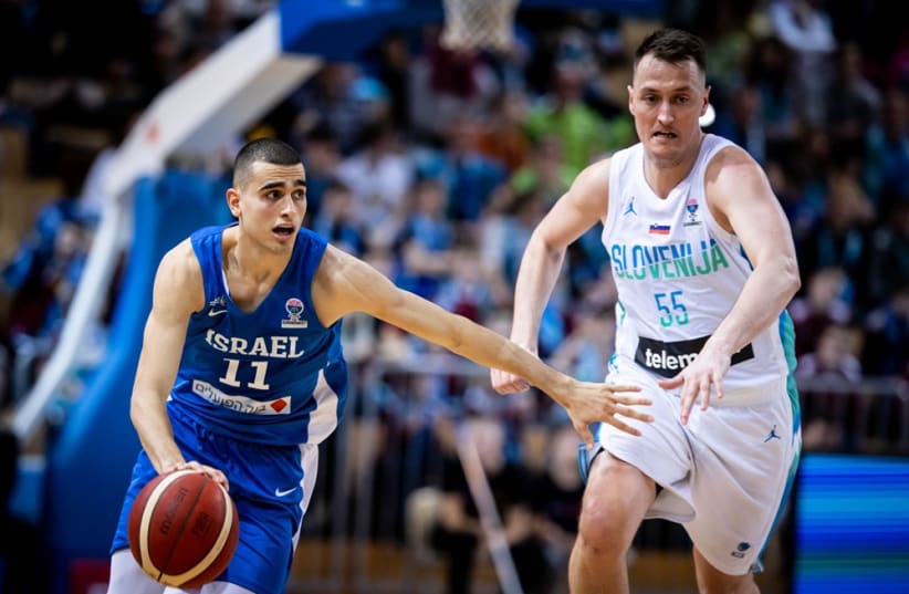  YAM MADAR (left) was a difference maker for Israel in both of its Eurobasket qualifiers over the weekend, scoring 16 points in the victory over Portugal and 19 points in the setback to Slovenia. (photo credit: FIBA/COURTESY)