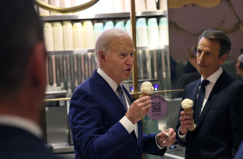  US President Joe Biden answers a question from a member of the news media as he and Seth Meyers visit Van Leeuwen Ice Cream in downtown New York, US February 26, 2024. (photo credit: REUTERS)