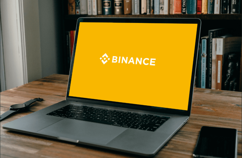  Binance with their logo on a laptop (photo credit: FLICKR)