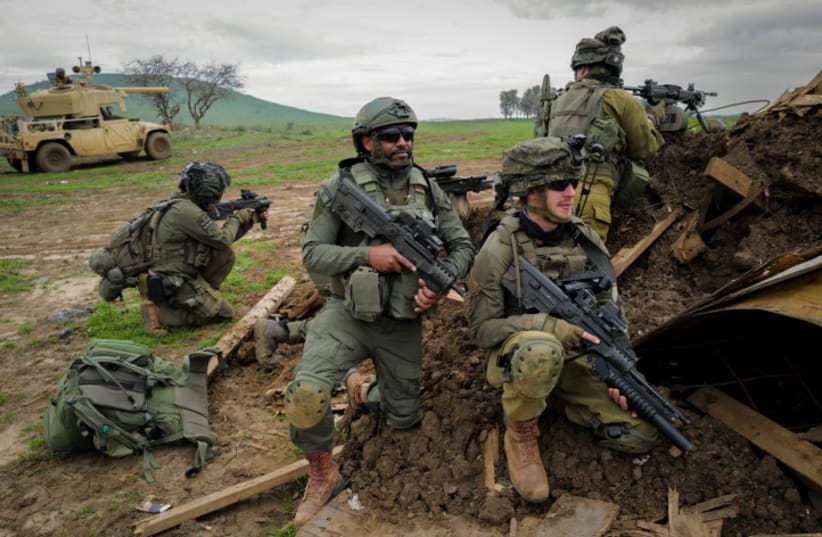  Israeli reserve soldiers from the Nachal brigade take part in a military drill in the Golan Heights, northern Israel, February 13, 2024 (photo credit: MICHAL GILADI/FLASH90)