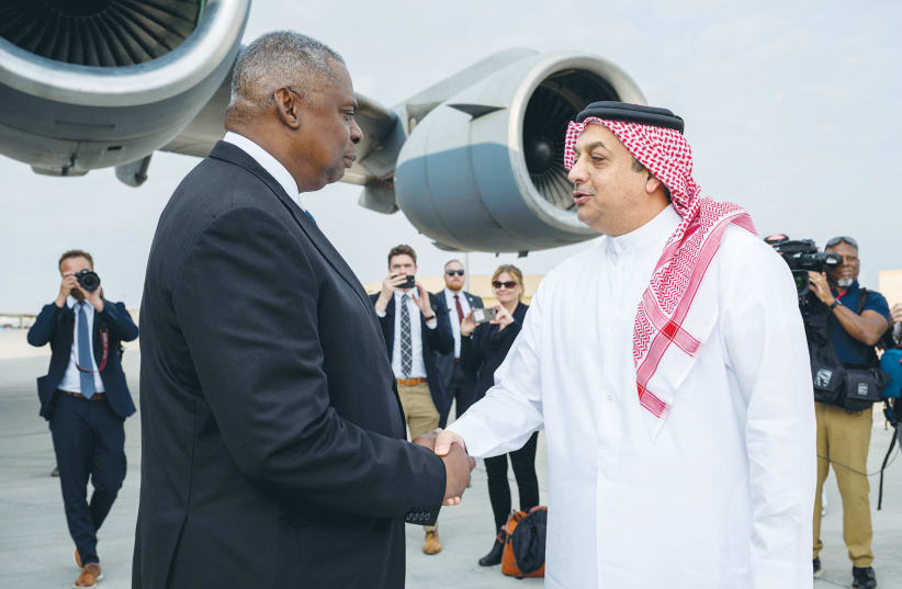  US DEFENSE Secretary Lloyd Austin is greeted by Qatar’s Defense Minister Khalid bin Mohammad Al Attiyah, during a visit to al-Udeid Air Base, in Doha, Qatar, in December. (photo credit: US Air Force/Reuters)