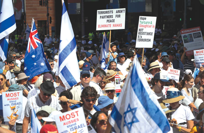  PEOPLE TAKE part in a ‘United With Israel – Bring Them Home’ protest in November in Sydney. (photo credit: LISA MAREE WILLIANS/GETTY IMAGES)