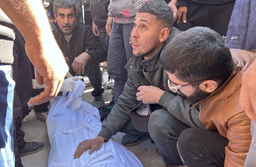 The funeral of Palestinians are brought from the Kamal Adwan hospital after Israeli forces opened fire on Palestinians waiting for humanitarian aid trucks at Al-Rashid Street in Gaza City, Gaza, Feb. 29, 2024. (photo credit: Mahmud Isa/Anadolu via Getty Images)