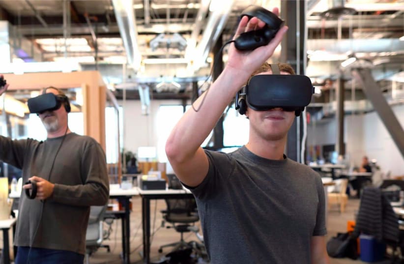 Meta CEO Mark Zuckerberg testing out the 'Orion' AR glasses prototype. (photo credit: FACEBOOK)