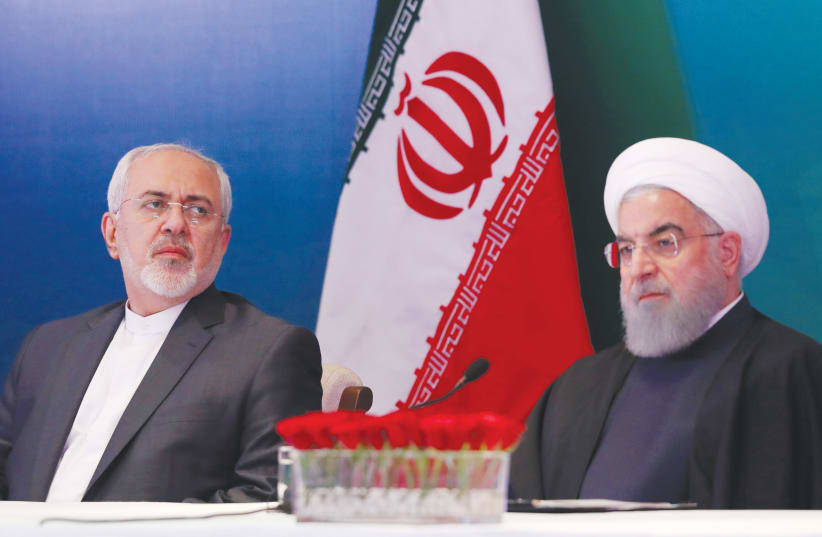  EL PRESIDENTE IRANÍ, Hassan Rouhani (derecha), y el ministro de Asuntos Exteriores, Javad Zarif. Quién quería pagar el precio de la acción moral para detener de verdad a Irán? (photo credit: DANISH SIDDIQUI/ REUTERS)