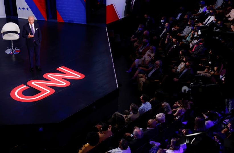  U.S. President Joe Biden speaks during a town hall about his infrastructure investment proposals with CNN's Anderson Cooper at the Baltimore Center Stage Pearlstone Theater in Baltimore, Maryland, U.S. October 21, 2021. (photo credit: JONATHAN ERNST/REUTERS)