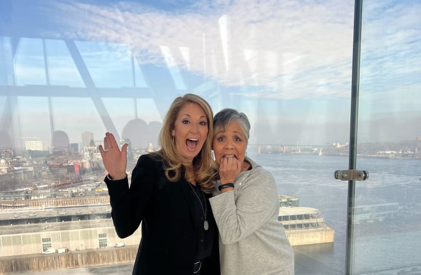  Podcast guests Shannon McKee and Linda Vasquez from Access Cruise Inc standing on a glass floor 65 meters above Montreal, Canada.  (photo credit: Courtesy)