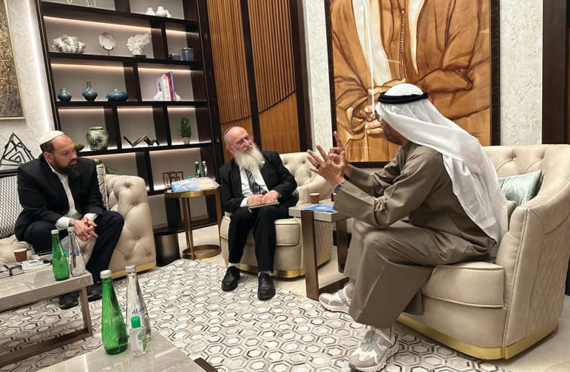  THE WRITER (center) meets in Dubai with Dr. Ali Rashid Al Nuaimi, chairman of the Defense Affairs, Interior and Foreign Affairs Committee of the UAE Federal National Council, and Rabbi Eyal Vered, an adult youth educator in religious Zionism.  (photo credit: Courtesy Ali Rashid Al Nuiami)