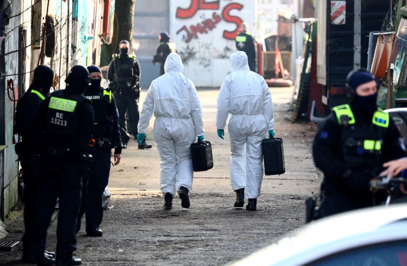 Forensic experts enter the area as special police searches for long-sought members Ernst Volker S. and Burkhard G. of Germany's notorious Red Army Faction (RAF) militant group, after decades on the run from armed robbery and attempted murder charges, in Berlin, Germany, March 3, 2024. (photo credit: Christian Mang/Reuters)