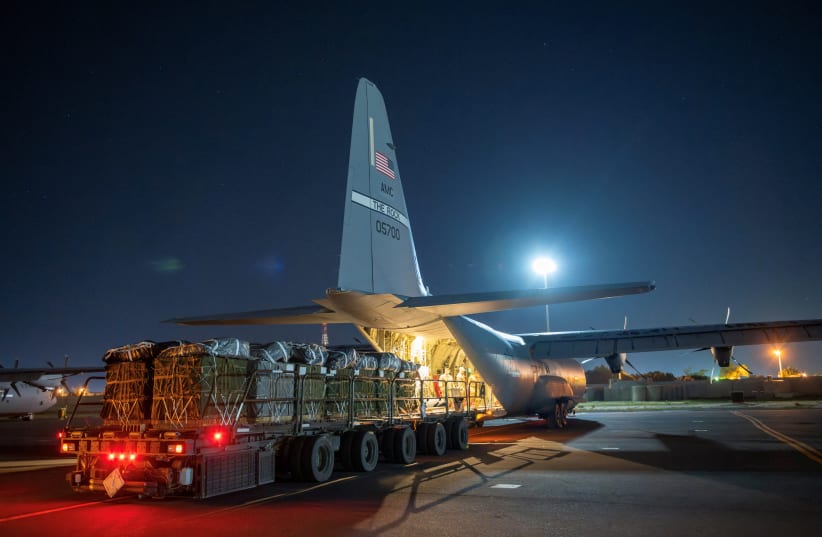  Over 38,000 Meals Ready to Eat and water destined for an airdrop over Gaza are loaded aboard a U.S. Air Force C-130J Super Hercules at an undisclosed location in Southwest Asia, March 1, 2024. U.S. Air Force (photo credit: REUTERS)