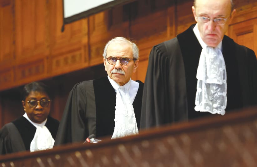  JUSTICES OF the International Court of Justice arrive for a hearing on the legal consequences of Israel’s occupation of Palestinian territories, in The Hague, last month. (photo credit: PIROSCHKA VAN DE WOUW/REUTERS)