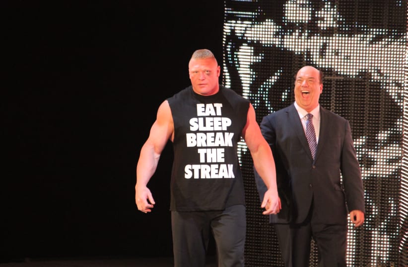  Brock Lesnar (left) and Paul Heyman a day after beating the Undertaker in Wrestlemania XXX. (photo credit: MEGAN ELICE MEADOWS VIA FLICKR/CC-SA 2.0 HTTPS://CREATIVECOMMONS.ORG/LICENSES/BY-SA/2.0/DEED.EN)