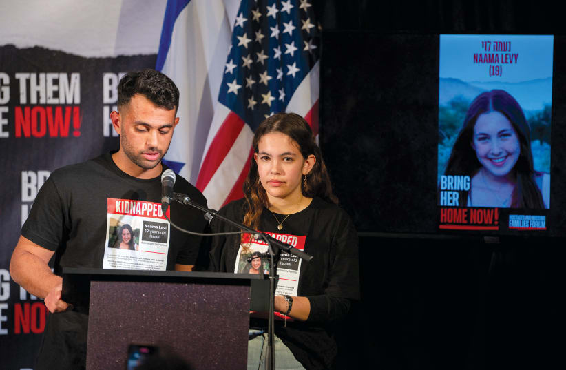  The siblings of Israeli hostage Na’ama Levy speak during a Lights for Liberty event demanding the release of the remaining hostages held in Gaza, in Manhattan on December 13, 2023.  (photo credit: David Dee Delgado/Reuters)