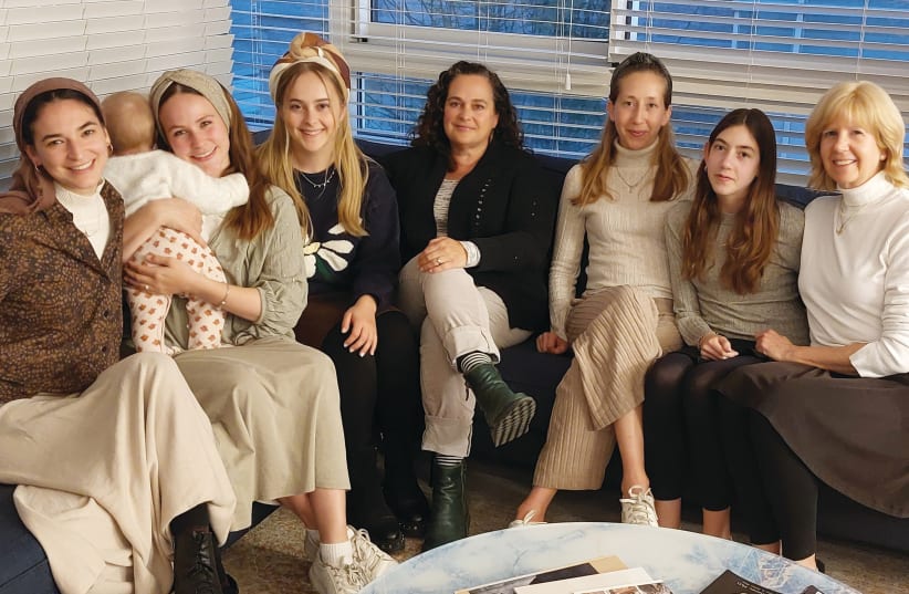  THE WOMEN who love Yosef (L-R): Charlie’s wife, Revital; Asher’s wife, Noor, with baby Ayala; Yosef’s wife, Senai; her mother, Norah Mazar; Yosef’s sisters Yael Ben Shimol and Elisheva; and their mother, Dina Guedalia. Not shown: sisters Shira Ephrat and Esther.  (photo credit: NATAN ROTHSTEIN)