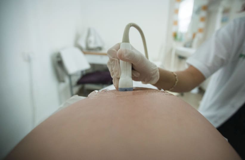  PERFORMING AN ultrasound on a pregnant woman. (photo credit: CHEN LEOPOLD/FLASH90)