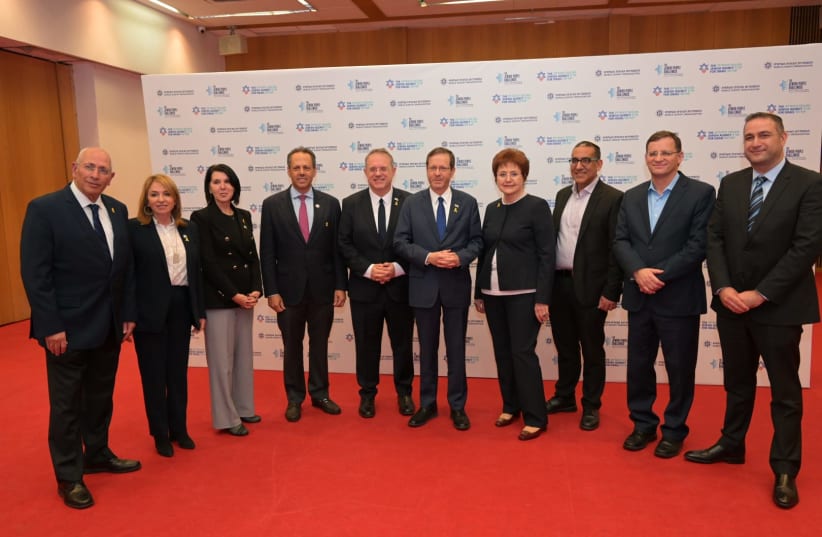  President Isaac Herzog and Yaakov Hagoel, Chairman of the World Zionist Organization with WZO staff at the Jewish People Challenges Conference. (photo credit: WZO)