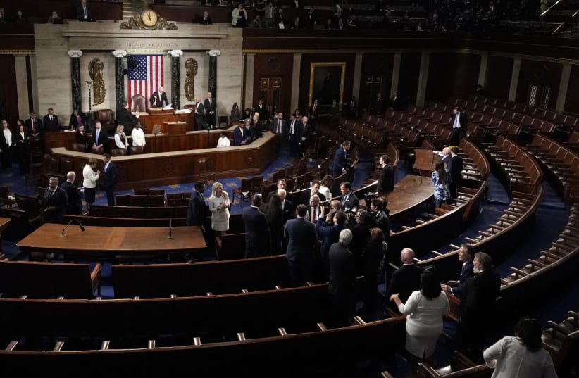 U.S. President Joe Biden remains in the nearly empty chamber greeting members of Congress following his State of the Union address at the U.S. Capitol in Washington, D.C., March 7, 2024.  (photo credit: REUTERS/ELIZABETH FRANTZ)