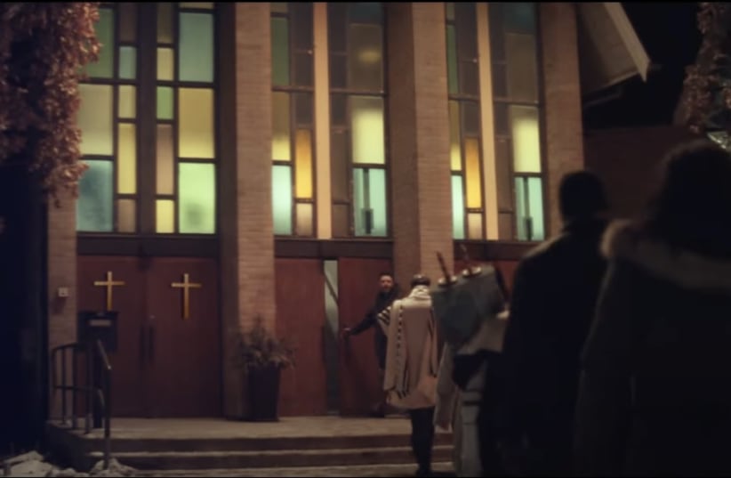  The "Neighbors" ad depicts a church welcoming in a nearby synagogue after a bar mitzvah service was interrupted by a bomb threat. (photo credit: screenshot)