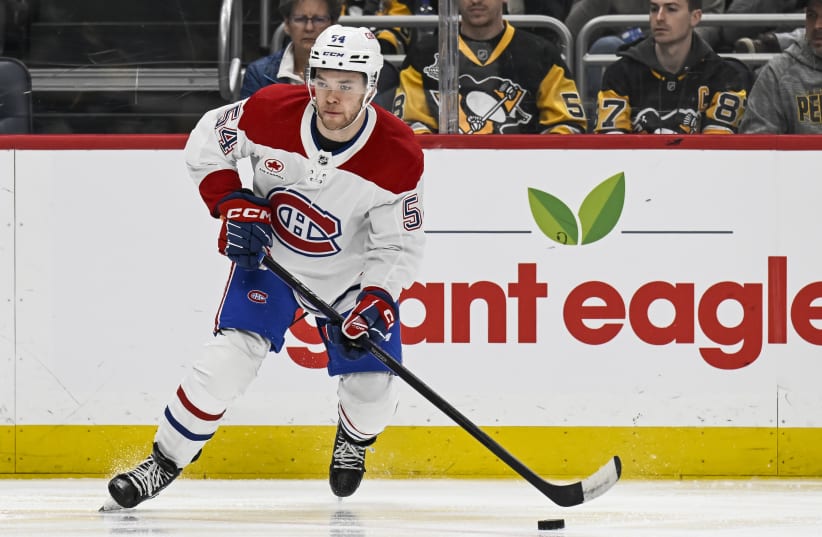  Montreal Canadiens defenseman Jordan Harris skates with the puck during a game against the Pittsburgh Penguins, Feb. 22, 2024  (photo credit: (Jeanine Leech/Icon Sportswire via Getty Images))