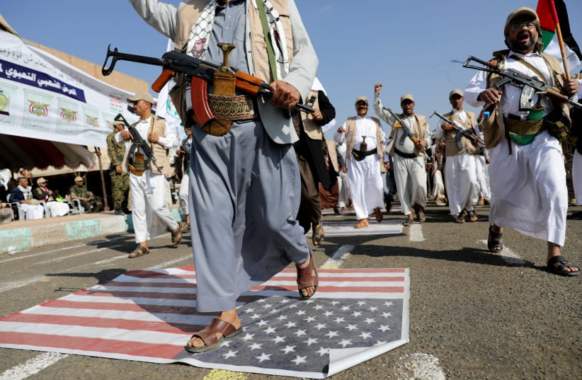  State servants parade following 12 days of military training they have received as part of a mobilization campaign by the Houthis in Sanaa, Yemen March 9, 2024.  (photo credit: KHALED ABDULLAH/REUTERS)
