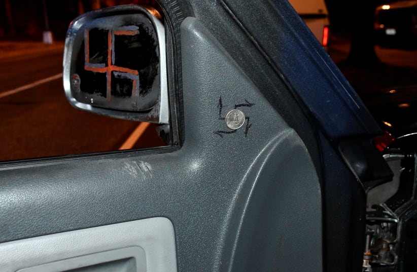  A photo released by the U.S. Capitol Police shows swastikas on the rear view mirror and inside a pickup truck driven by Donald Craighead, 44, of Oceanside, California at the time his arrest for possession of prohibited weapons near the Democratic National Committee headquarters on Capitol Hill in W (photo credit:  Capitol Police/Handout via REUTERS)
