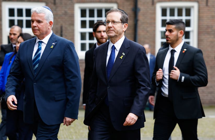  Israeli President Isaac Herzog walks near the Portuguese Synagogue on the day of the opening of the National Holocaust Museum, in Amsterdam, Netherlands, March 10, 2024. (photo credit: PIROSCHKA VAN DE WOUW/REUTERS)