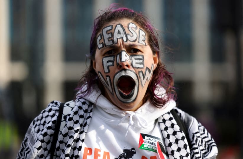  A woman with her face painted poses for a photo during a pro-Palestinian protest, amid the ongoing conflict between Israel and the Palestinian Islamist group Hamas, in London, Britain March 9, 2024. (photo credit: REUTERS/HOLLIE ADAMS)