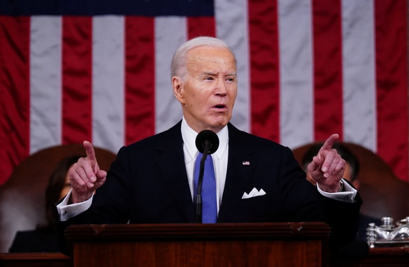  El presidente de EE.UU., Joe Biden, pronuncia su tercer discurso sobre el Estado de la Unión en la Cámara de Representantes del Capitolio de EE.UU. en Washington, DC, EE.UU., el 07 de marzo de 2024. (photo credit: SHAWN THEW/POOL VIA REUTERS)