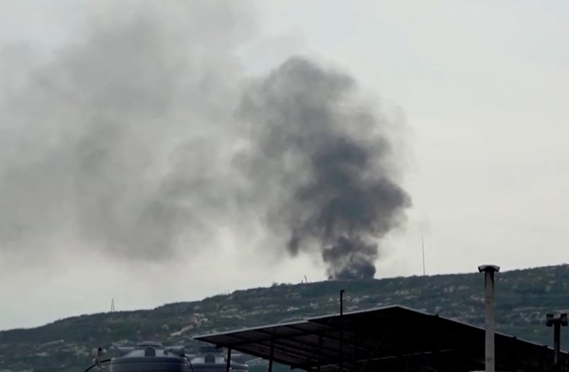  Black smoke rises from a site believed to have been hit by an Israeli strike, in southern Lebanon, in this screen grab taken from a video, February 27, 2024. (photo credit: REUTERS/Reuters TV)