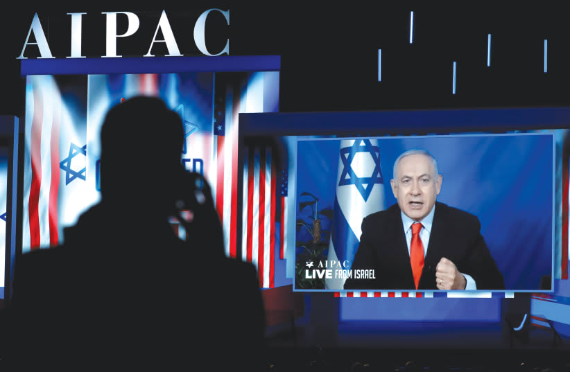  El PRIMER MINISTRO Benjamín Netanyahu pronuncia un discurso en vídeo ante el AIPAC en 2019 (photo credit: KEVIN LAMARQUE/REUTERS)