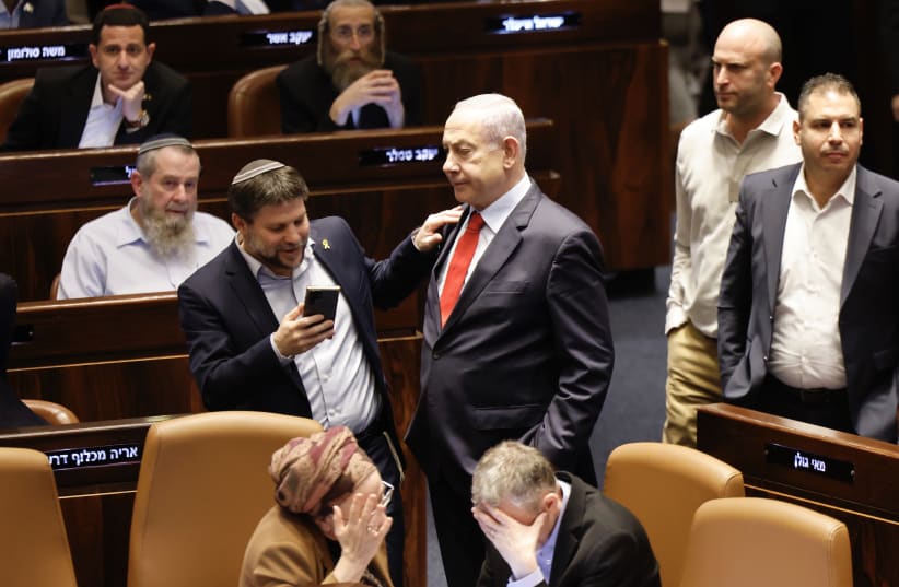  Finance Minister Bezalel Smotrich and Prime Minister Benjamin Netanyahu in the Knesset plenum on March 13, 2024 (photo credit: MARC ISRAEL SELLEM/THE JERUSALEM POST)
