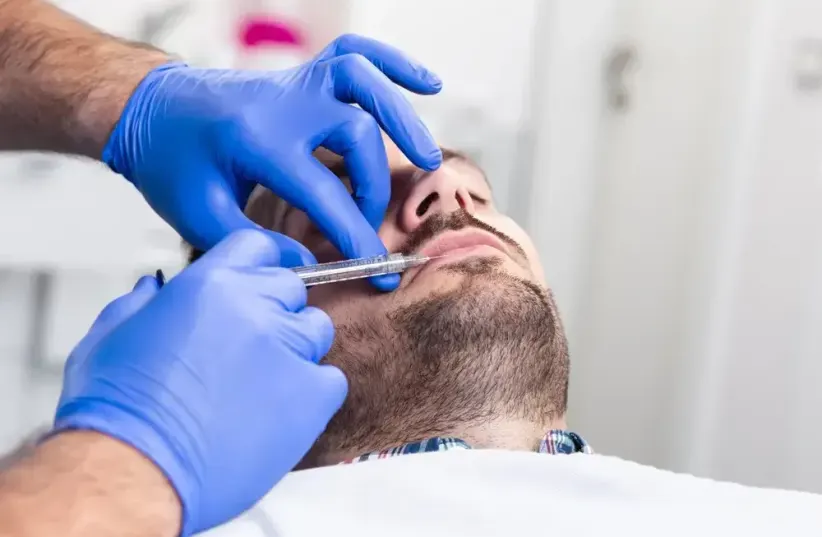   Today more than ever, it is easy to look young. A man undergoing aesthetic treatment /  (photo credit: SHUTTERSTOCK)